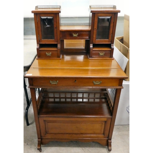 106 - An Edwardian mahogany one-piece writing desk, the desk top with glazed and drawer sections, incorpor... 