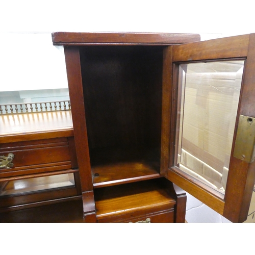 106 - An Edwardian mahogany one-piece writing desk, the desk top with glazed and drawer sections, incorpor... 