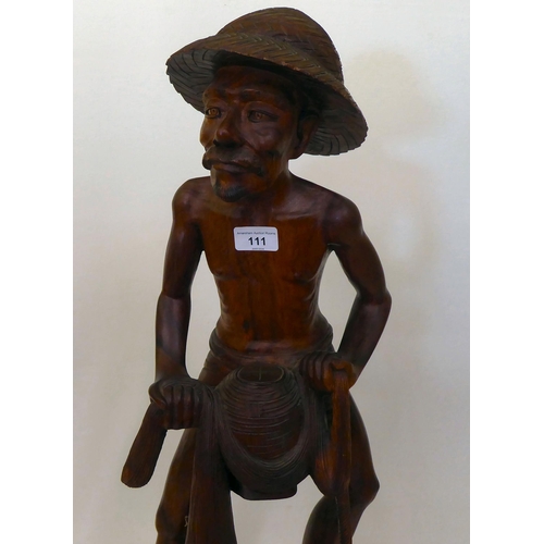 111 - An Asian carved hardwood figure, an Artisan fisherman  32