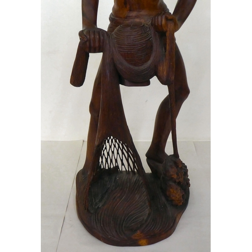 111 - An Asian carved hardwood figure, an Artisan fisherman  32