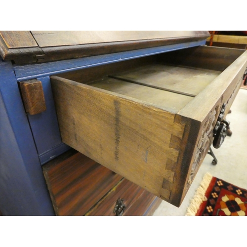 257 - A mid 20thC oak bureau with a fall flap, over three long drawers, raised on bracket feet  39