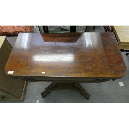 262 - A William IV rosewood card table with a fold-over top, enclosing a baize lined interior, raised on a... 