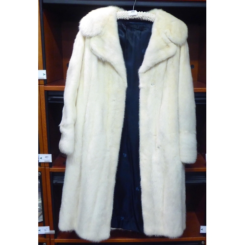 266 - A lady's blonde mink three-quarter length coat  approx size 14