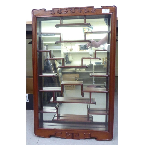 267 - A modern rosewood Shodana wall cabinet, the glazed door enclosing tiered shelves  31