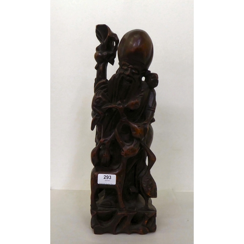 293 - A 20thC Chinese carved fruitwood figure, an elderly man  18