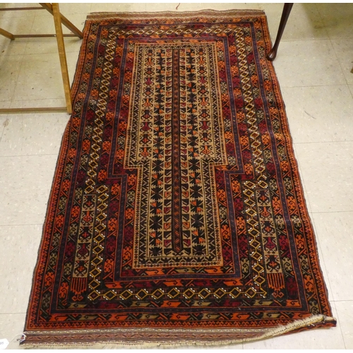 295 - A Persian rug with a central medallion, on a red ground  36