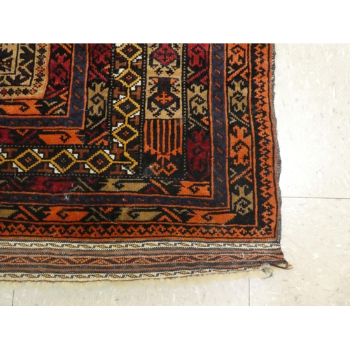 295 - A Persian rug with a central medallion, on a red ground  36