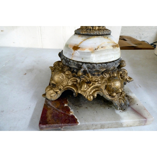 38 - A modern gilt metal and onyx coffee table with opposing cherubic uprights and platform feet  17... 