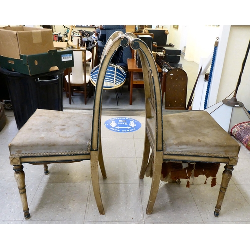 42 - A pair of 19thC French painted beech framed side chairs with rail crests and anthemion splats, the u... 