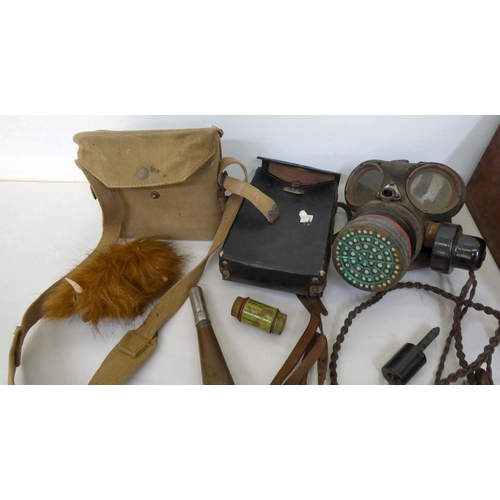 52 - A mixed lot: to include a British World War II gas mask; and headphones 