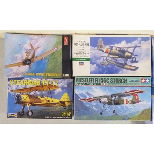 62 - 1/48 scale model kits: to include a Fiesler Fi156C Storch by Tamiya; and a SBD 5 Dauntless by Italer... 