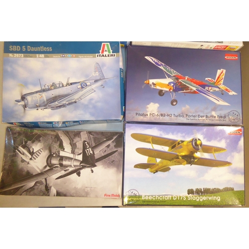 62 - 1/48 scale model kits: to include a Fiesler Fi156C Storch by Tamiya; and a SBD 5 Dauntless by Italer... 