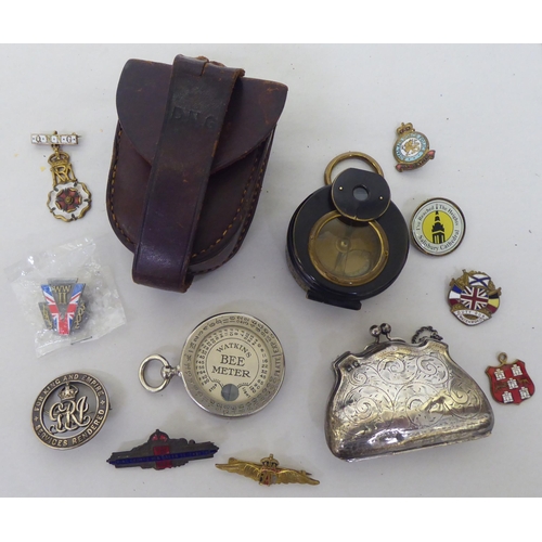 82 - A mixed lot: to include a silver bag design purse, on a crossover clasp; a Watkins Bee Meter; and a ... 