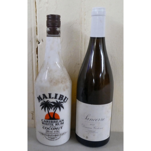 9 - Wines and spirits: to include two bottles of Caldirola; and a Remy Martin Cognac