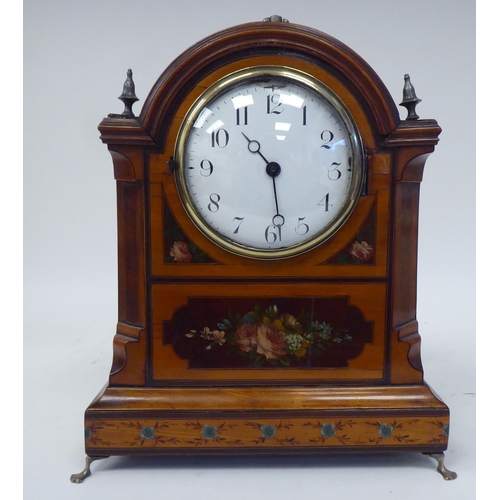 10 - An Edwardian inlaid and floral painted satinwood cased mantel timepiece with a round arch top, foldi... 