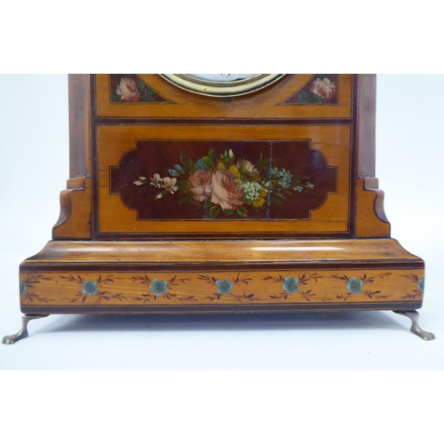 10 - An Edwardian inlaid and floral painted satinwood cased mantel timepiece with a round arch top, foldi... 