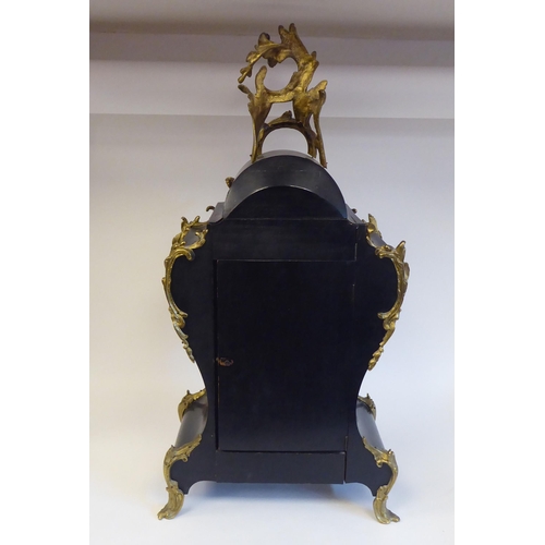 12 - A late 19thC Continental boulleworked and ebonised cased mantel clock of waisted balloon design with... 