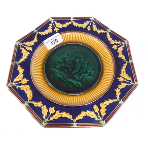 170 - A Wedgwood majolica comport, the octagonal plate featuring cavorting cherubic figures within a wide ... 