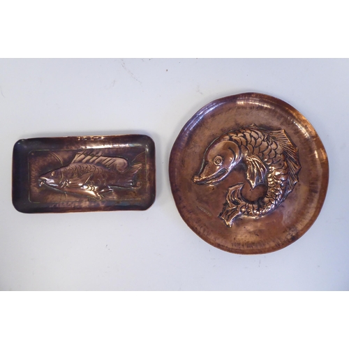 180 - Two dissimilar items of Arts & Crafts Newlyn copper ware with embossed fish ornament and marks, ... 