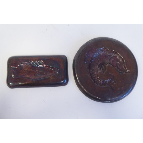 180 - Two dissimilar items of Arts & Crafts Newlyn copper ware with embossed fish ornament and marks, ... 