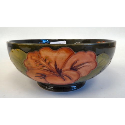 183 - A Moorcroft pottery footed bowl, decorated in tubeline and colours with a version of The Hibiscus de... 