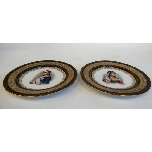 188 - A pair of 19thC Continental porcelain portrait plates, depicting Napoleon and Josephine within extra... 