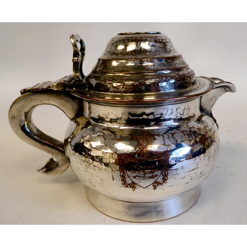 189 - A 19thC Continental white metal coffee jug of squat, bulbous form with an S-shape handle and hinged ... 