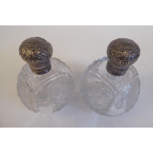 2 - A pair of Victorian hobnail cut glass dressing table bottles with applied silver collars and mushroo... 