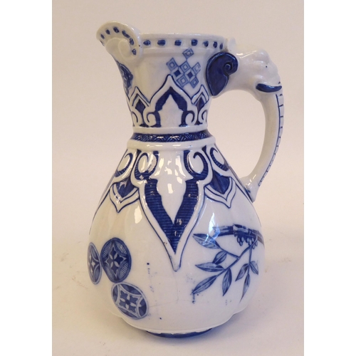 208 - A late 19thC Royal Worcester china water jug of pear design with a moulded elephant's head handle, n... 