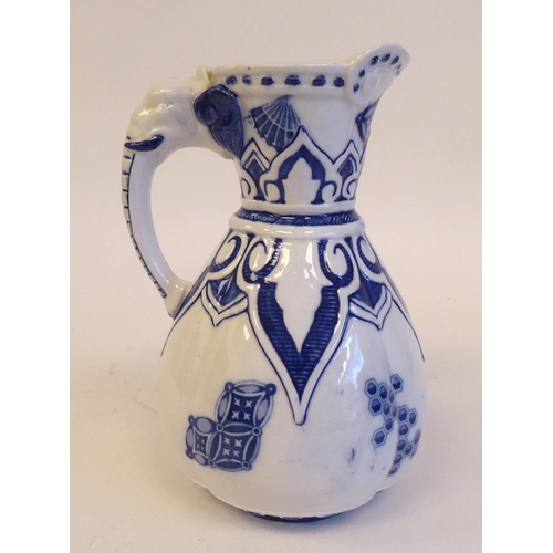 208 - A late 19thC Royal Worcester china water jug of pear design with a moulded elephant's head handle, n... 