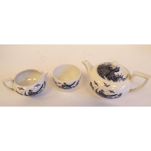 210 - A Wedgwood three piece china bachelor's tea set, decorated in monochrome on white with gamebirds