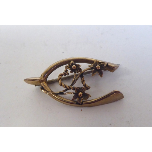 230 - Two 9ct gold wishbone design brooches; and a 9ct gold signet ring