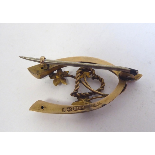 230 - Two 9ct gold wishbone design brooches; and a 9ct gold signet ring