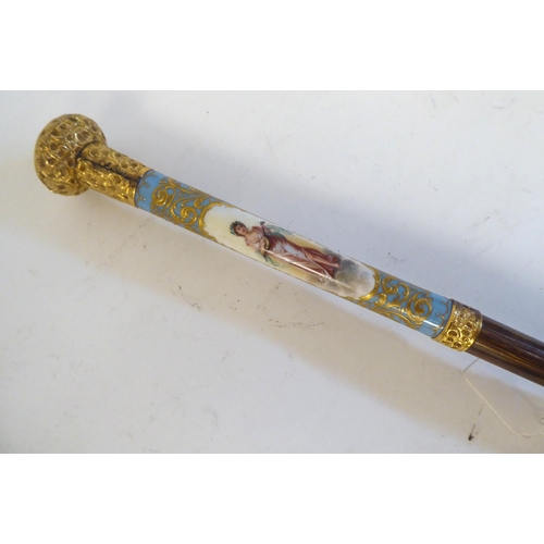 238 - A late 19thC Continental parasol with a painted porcelain handle, depicting a woman playing a musica... 