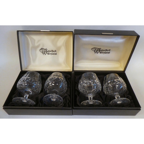 243 - A set of four Waterford crystal brandy balloons, in Harrods presentation boxes