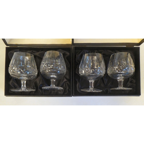 243 - A set of four Waterford crystal brandy balloons, in Harrods presentation boxes