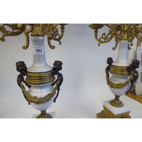 262 - A pair of 19thC style Continental neo-classical lacquered brass and white alabaster candelabra, each... 