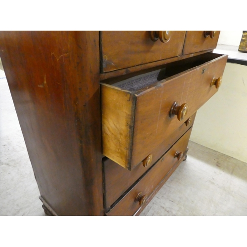 264 - A mid Victorian mahogany five drawer dressing chest, on a plinth and block feet  42