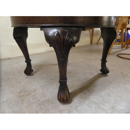 265 - A 1930s Queen Anne inspired crossbanded walnut coffee table, raised on shell carved, fluted legs&nbs... 