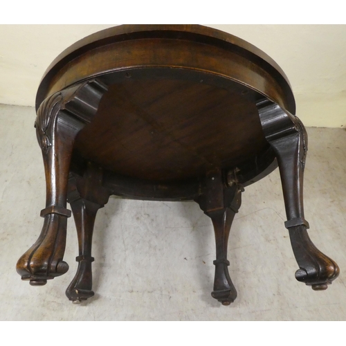 265 - A 1930s Queen Anne inspired crossbanded walnut coffee table, raised on shell carved, fluted legs&nbs... 