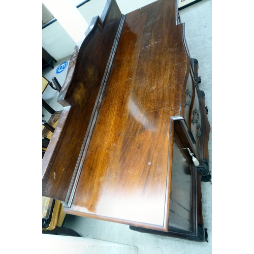 270 - A 1930s mahogany breakfront, bow fronted sideboard with a central bank of three drawers, flanked by ... 