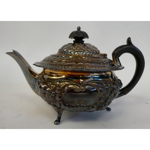 274 - A late Victorian silver bachelor's teapot of squat, bulbous form, having a swept spout, insulated ha... 