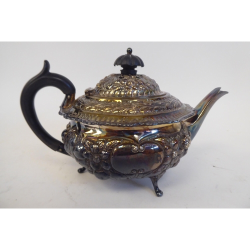 274 - A late Victorian silver bachelor's teapot of squat, bulbous form, having a swept spout, insulated ha... 