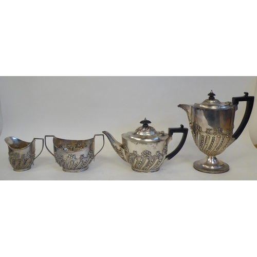 275 - A late Victorian silver four piece tea set of oval, demi-reeded form, comprising a teapot with a swe... 