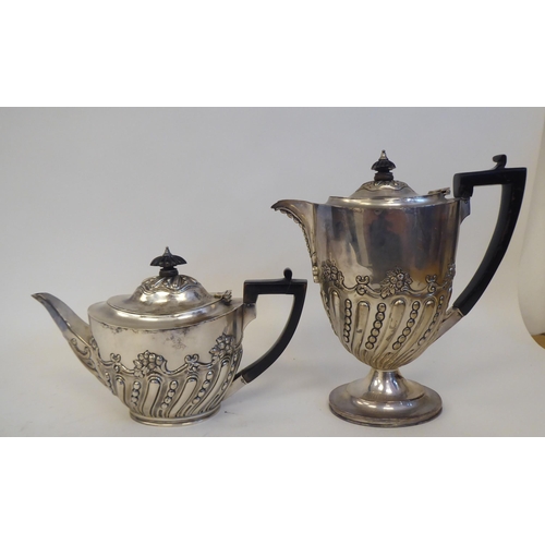 275 - A late Victorian silver four piece tea set of oval, demi-reeded form, comprising a teapot with a swe... 