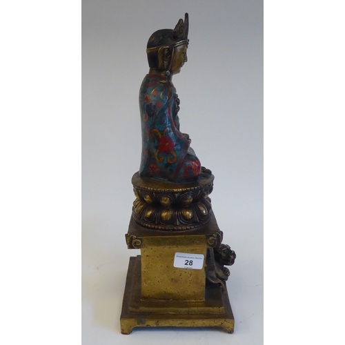 28 - An Asian cast brass and cloisonné Buddhist figure, seated cross-legged on a cushion plinth, g... 