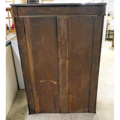 285 - An early 20thC mahogany bookcase with two glazed doors, on a plinth  45