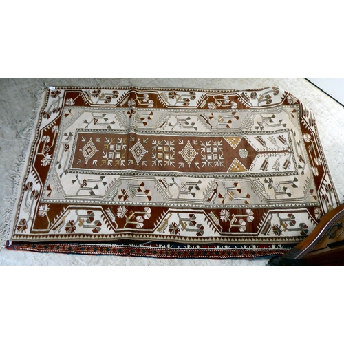 297 - Three dissimilar rugs: to include a Turkish example with repeating box design motifs, on a multi-col... 