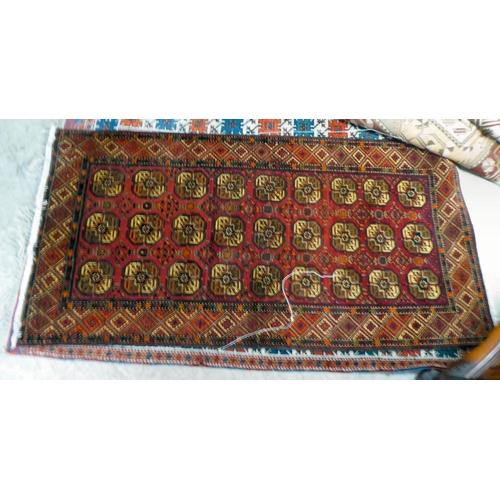 297 - Three dissimilar rugs: to include a Turkish example with repeating box design motifs, on a multi-col... 