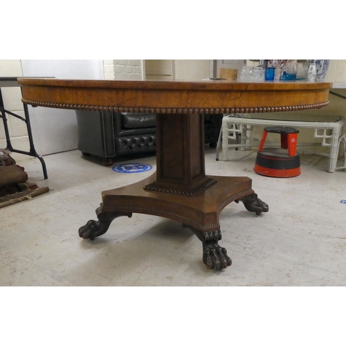 35 - A William IV pollard oak and rosewood centre table, the tip-top with crossbanded border ornament and... 